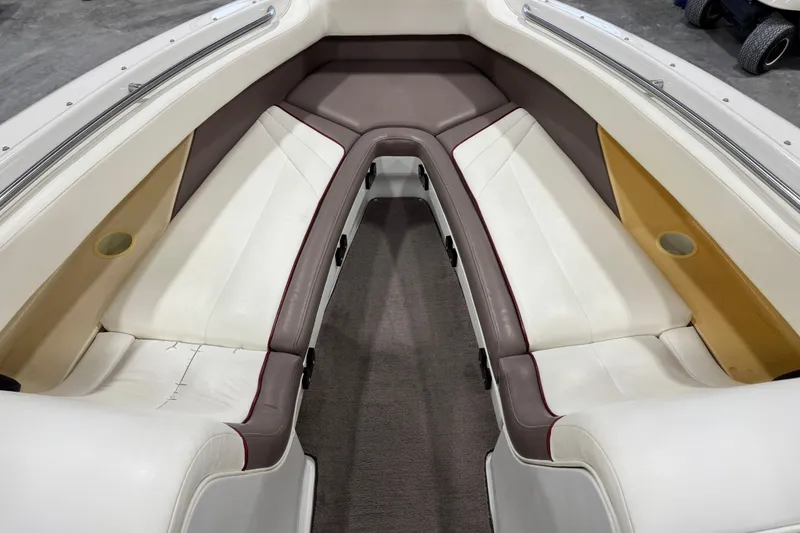 Slide: The Image of Interior of a 1995 Cobalt 252 boat with white and brown seating. - 21