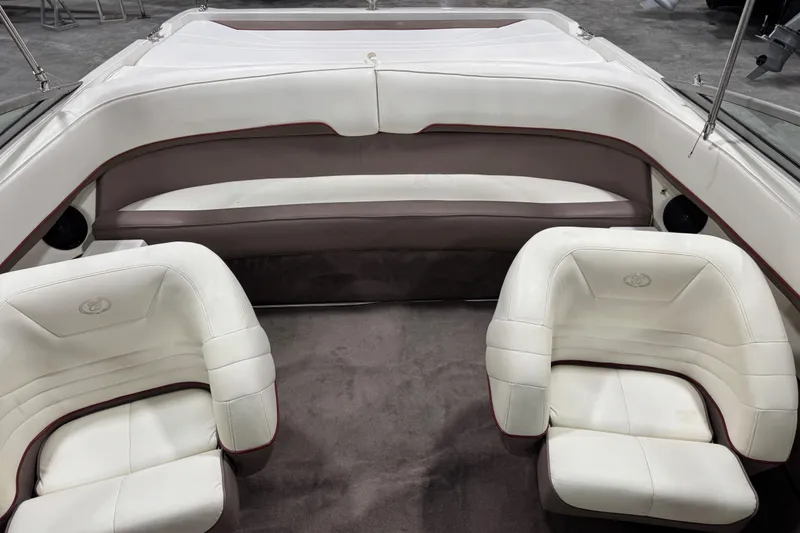 Slide: The Image of Interior of a 1995 Cobalt 252 boat with white and gray seating. - 22