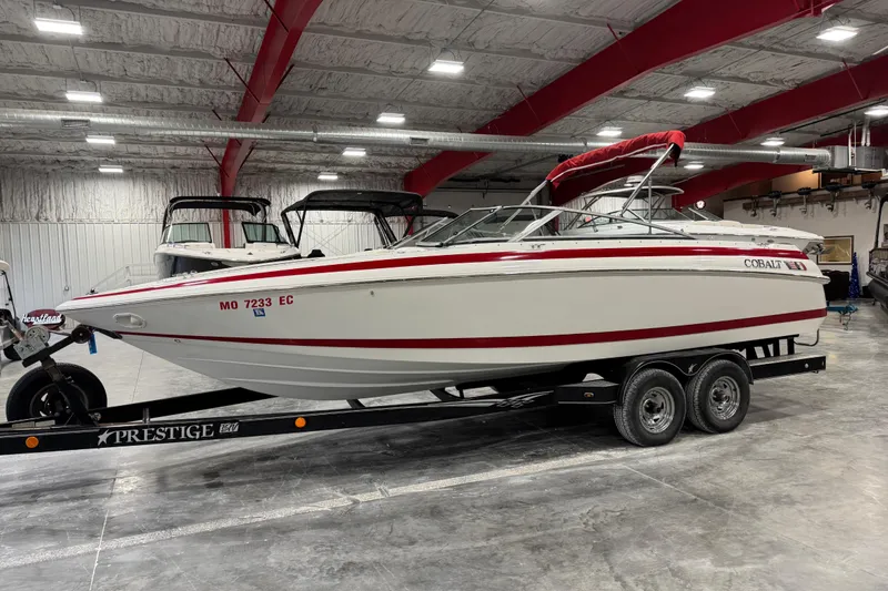 Slide: The Image of 1995 Cobalt 252 boat on trailer in indoor storage facility. - 6