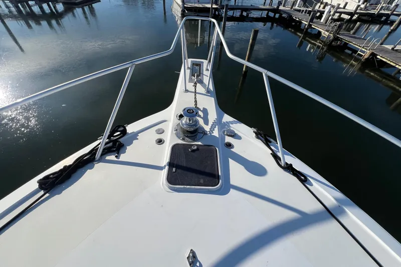 Slide: The Image of Bow view of 1999 Ocean Yachts 56 Super Sport at marina. - 19