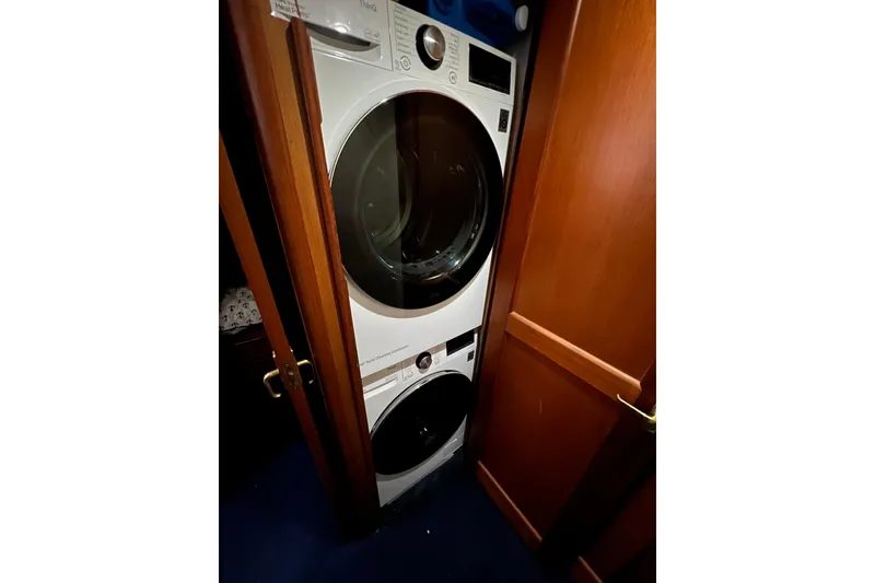 Slide: The Image of Stacked washer and dryer in 1999 Ocean Yachts 56 Super Sport interior. - 49