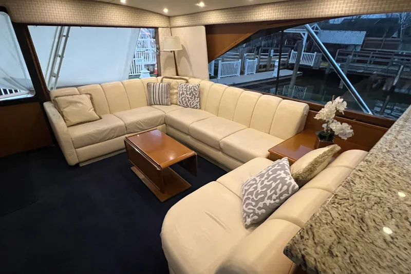 Slide: The Image of Luxurious interior of 1999 Ocean Yachts 56 Super Sport with plush seating and elegant decor. - 55