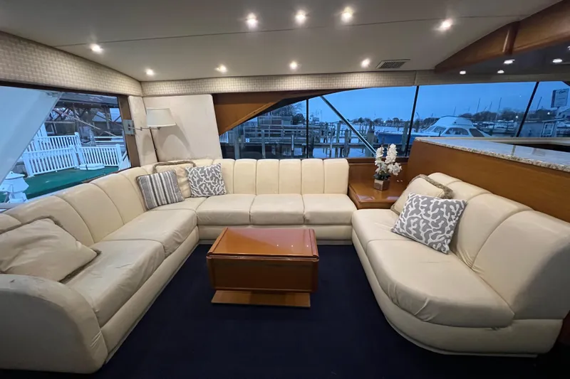 Slide: The Image of Luxurious interior of 1999 Ocean Yachts 56 Super Sport with plush seating and elegant decor. - 56