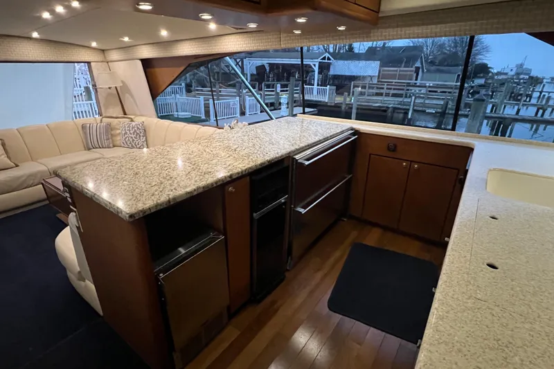 Slide: The Image of Luxurious interior of 1999 Ocean Yachts 56 Super Sport with granite countertops and waterfront view. - 2