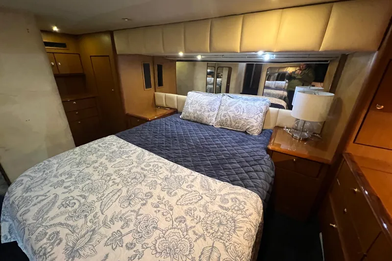 Slide: The Image of Luxurious bedroom interior of 1999 Ocean Yachts 56 Super Sport with elegant bedding. - 25