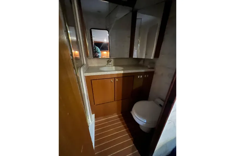 Slide: The Image of Bathroom interior of 1999 Ocean Yachts 56 Super Sport with wooden cabinetry. - 27