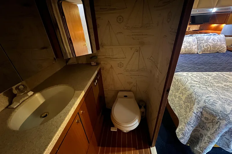 Slide: The Image of Bathroom and bedroom interior of 1999 Ocean Yachts 56 Super Sport. - 30