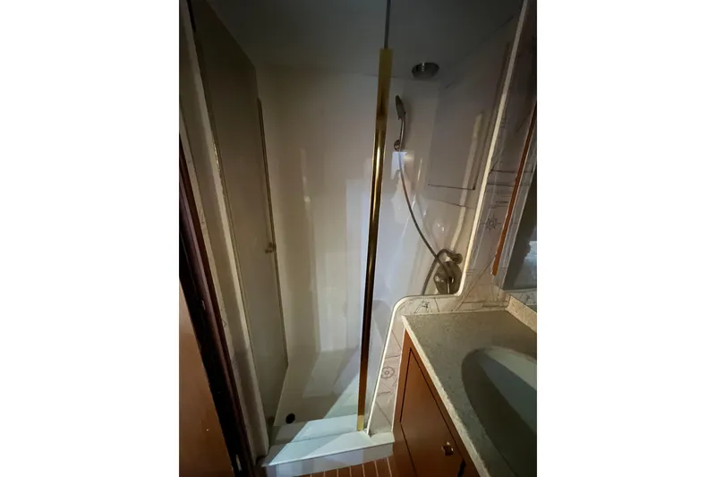 Slide: The Image of Shower area in 1999 Ocean Yachts 56 Super Sport, featuring sleek design and modern fixtures. - 31