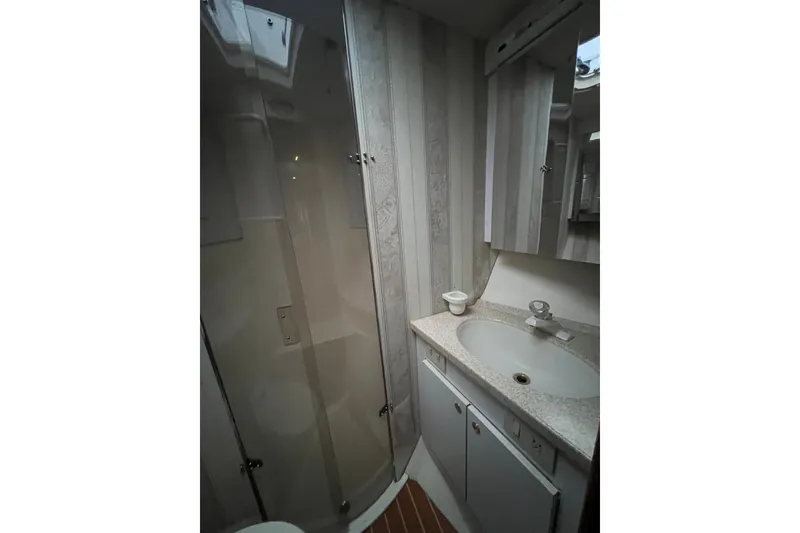 Slide: The Image of Bathroom interior of 1999 Ocean Yachts 56 Super Sport with shower and sink. - 38
