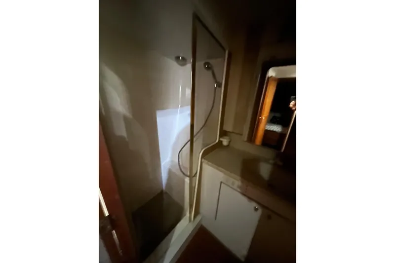 Slide: The Image of Bathroom interior of 1999 Ocean Yachts 56 Super Sport with shower and vanity. - 48