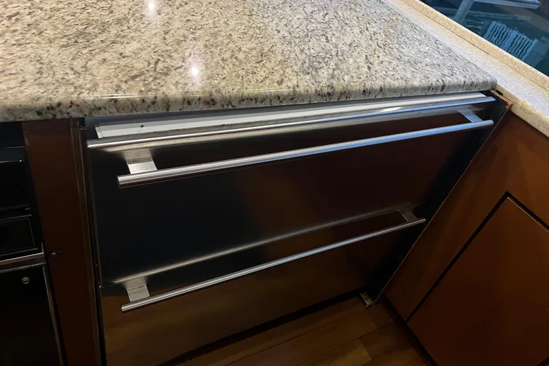 Slide: The Image of Granite countertop and stainless steel drawers on 1999 Ocean Yachts 56 Super Sport. - 59