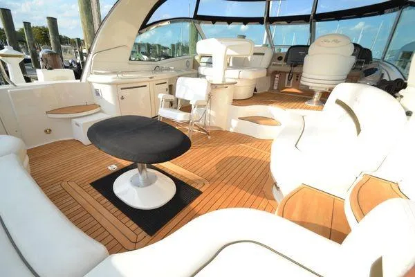 Slide: The Image of Luxurious 2007 Sea Ray Sundancer 520 yacht interior with elegant seating and wooden flooring. - 10