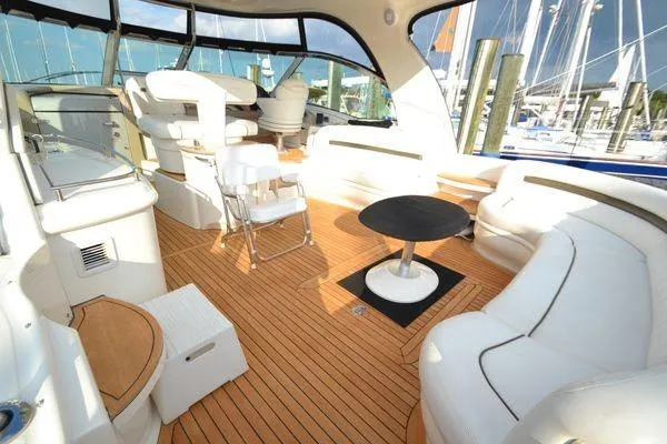 Slide: The Image of Luxurious 2007 Sea Ray Sundancer 520 yacht interior with elegant seating and wooden flooring. - 11