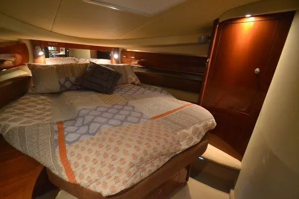 Slide: The Image of Luxurious cabin interior of 2007 Sea Ray Sundancer 520 yacht with cozy bedding. - 22