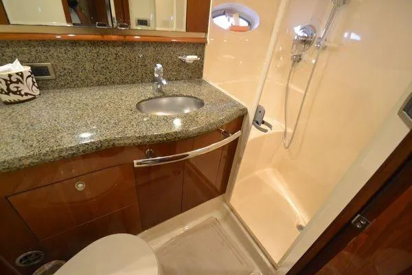 Slide: The Image of Luxurious bathroom in 2007 Sea Ray Sundancer 520 yacht with granite countertop and shower. - 25