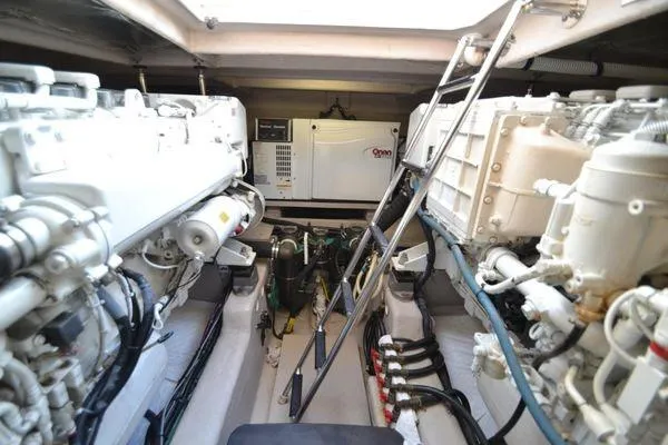 Slide: The Image of Engine room of 2007 Sea Ray Sundancer 520 yacht, featuring dual engines and equipment. - 26