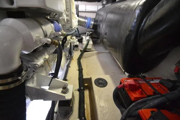 Slide: The Image of Engine compartment of a 2007 Sea Ray Sundancer 520, showcasing mechanical components and wiring. - 29