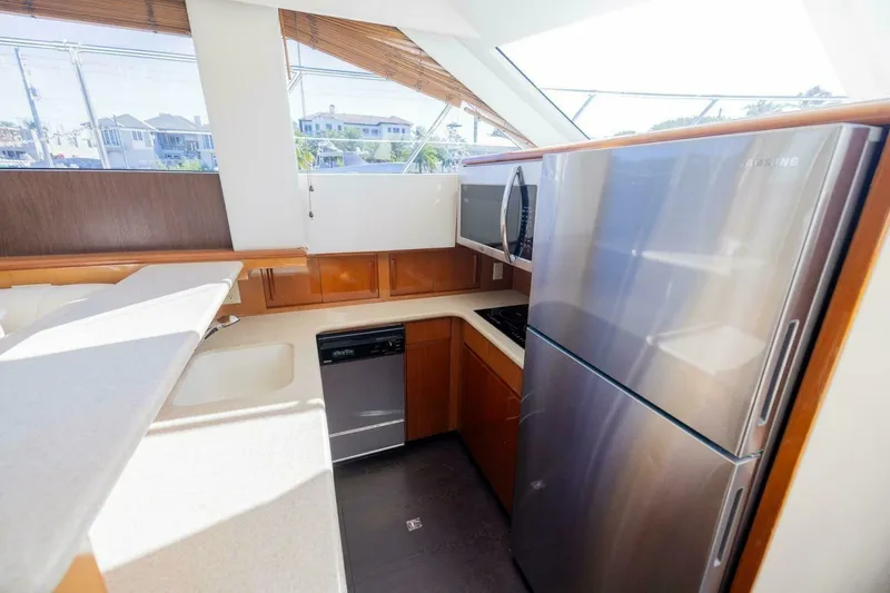Slide: The Image of Modern kitchen in 1999 Hatteras 52 Sport Deck Motor Yacht with stainless steel appliances. - 8