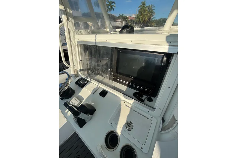 Slide: The Image of 2012 Yellowfin 32 Offshore boat console with navigation equipment and controls. - 3