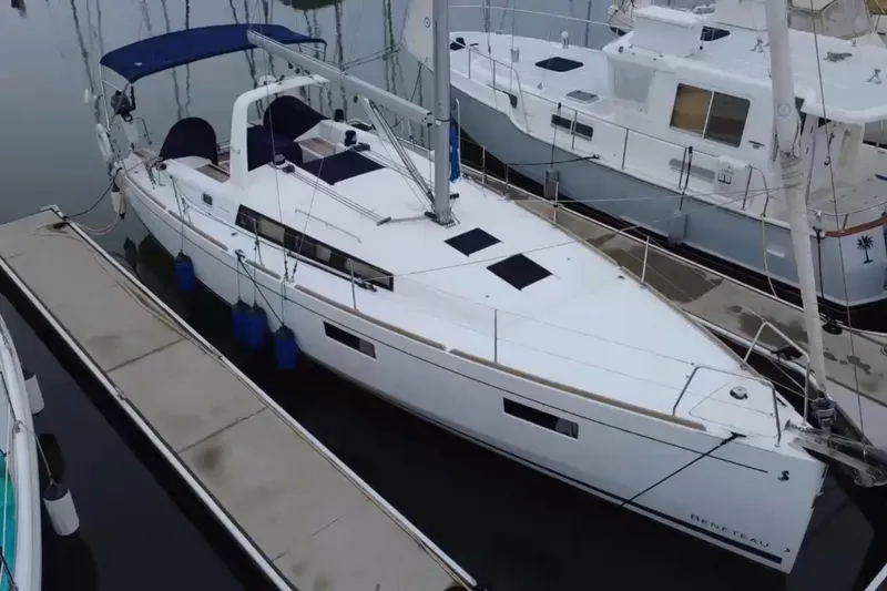The Image of 2019 Beneteau Oceanis 38.1 sailboat docked at marina, side view. - 0