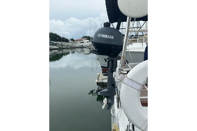 Slide: The Image of Yamaha outboard motor on 2019 Beneteau Oceanis 38.1, docked in a serene marina. - 19