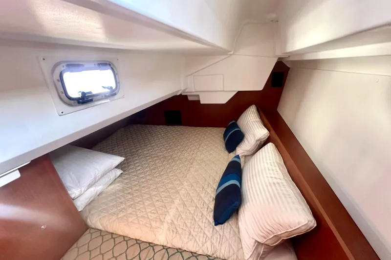Slide: The Image of Interior of Beneteau Oceanis 38.1 yacht, cozy cabin with bed. - 6