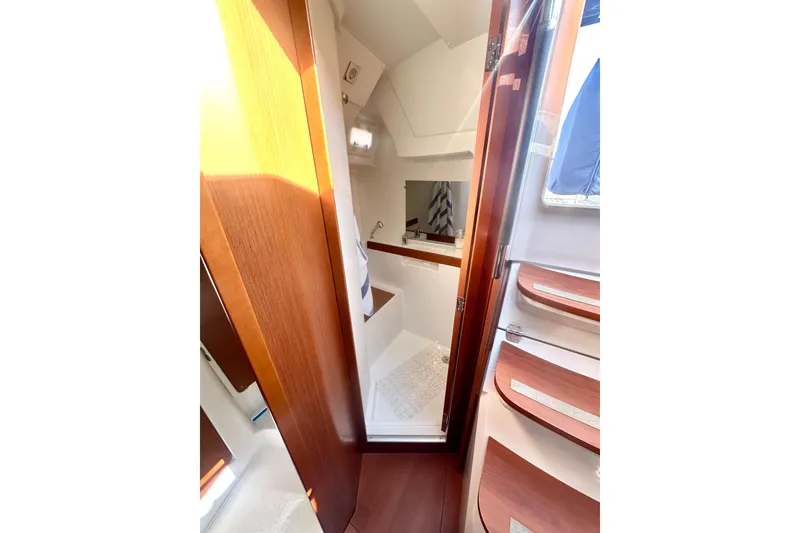 Slide: The Image of Interior of 2019 Beneteau Oceanis 38.1 yacht, featuring a compact bathroom space. - 7