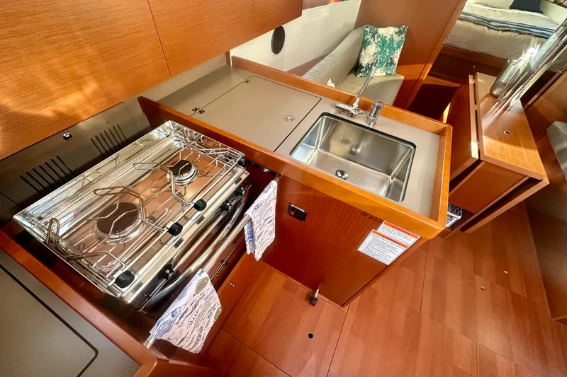 Slide: The Image of Modern kitchen in 2019 Beneteau Oceanis 38.1 yacht with stove and sink. - 9