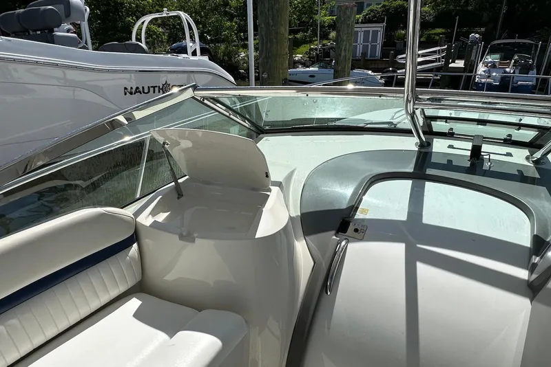 Slide: The Image of 2009 Monterey 350 Sport Yacht interior with seating and open hatch, docked at marina. - 10