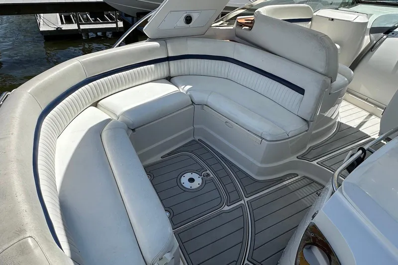 Slide: The Image of Luxurious seating area on a 2009 Monterey 350 Sport Yacht, featuring elegant white upholstery. - 13
