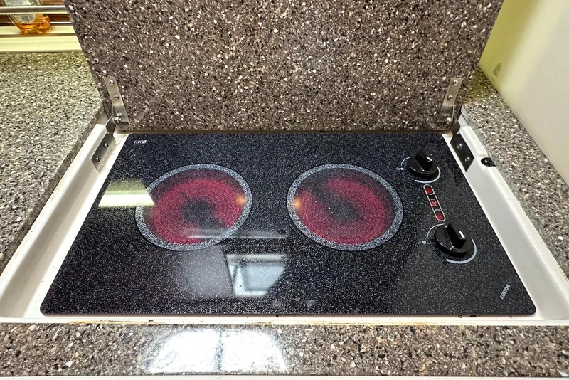 Slide: The Image of Electric stovetop on 2009 Monterey 350 Sport Yacht with granite countertop. - 27