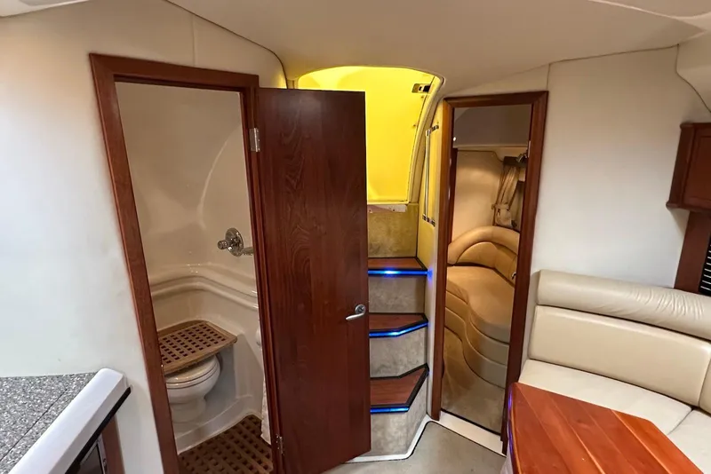Slide: The Image of Interior of 2009 Monterey 350 Sport Yacht featuring bathroom, stairs, and seating area. - 37