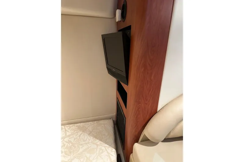 Slide: The Image of Interior of 2009 Monterey 350 Sport Yacht with TV and wood paneling. - 43