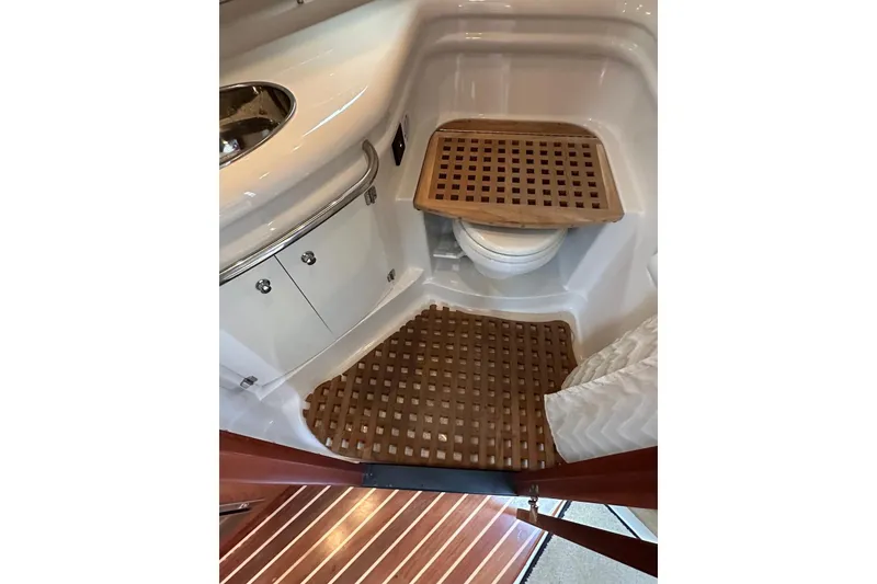 Slide: The Image of 2009 Monterey 350 Sport Yacht bathroom with wooden floor mats and compact sink. - 47