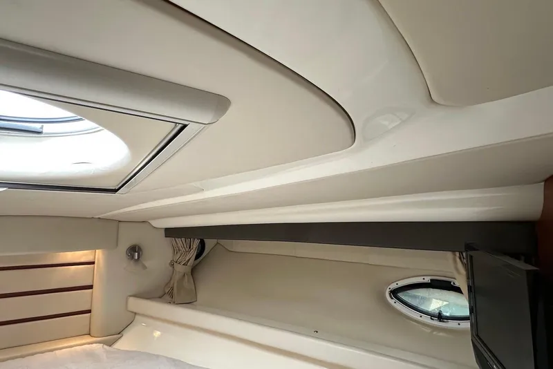 Slide: The Image of Interior cabin of 2009 Monterey 350 Sport Yacht with porthole and skylight. - 48