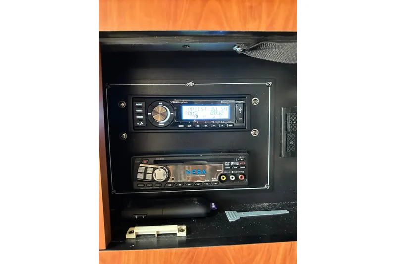 Slide: The Image of Audio system controls on a 2009 Monterey 350 Sport Yacht dashboard. - 49