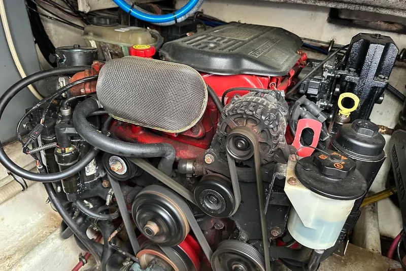 Slide: The Image of Engine of a 2009 Monterey 350 Sport Yacht, showcasing belts and components. - 51