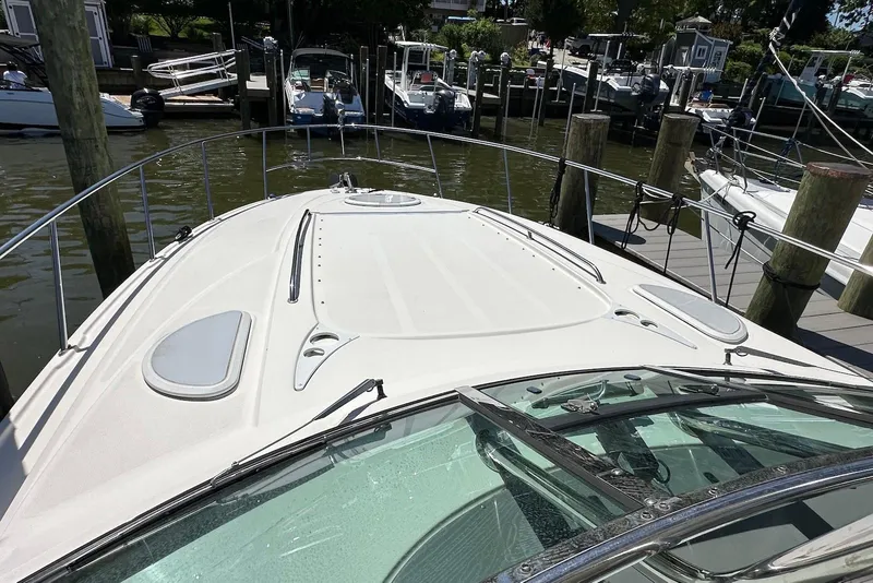 Slide: The Image of 2009 Monterey 350 Sport Yacht docked at marina, showcasing sleek deck design. - 7
