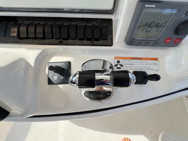 Slide: The Image of Control panel of a 2007 Sea Ray 52 Sedan Bridge yacht with navigation instruments. - 11