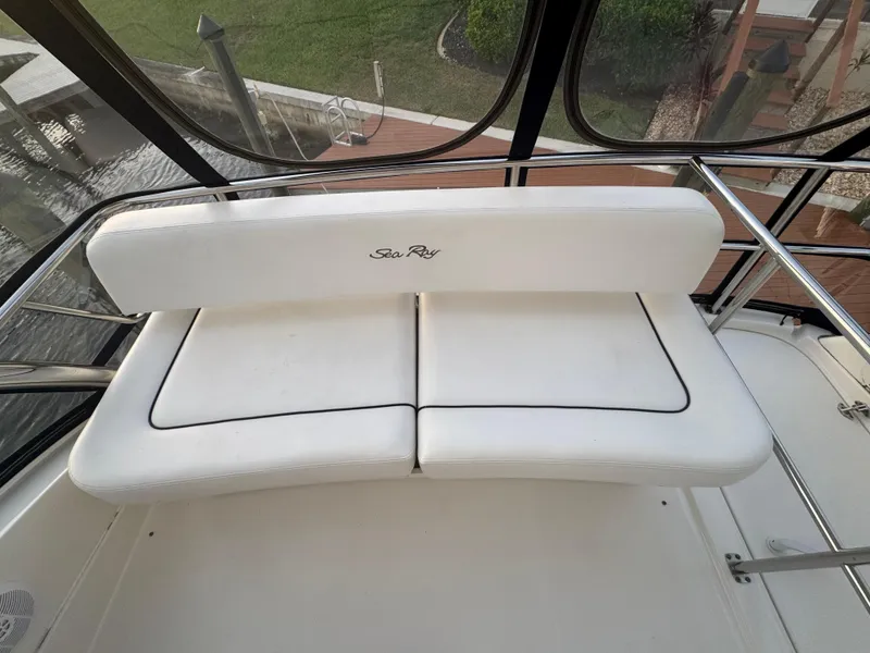 Slide: The Image of White seating on 2007 Sea Ray 52 Sedan Bridge yacht, featuring sleek design and waterfront view. - 14