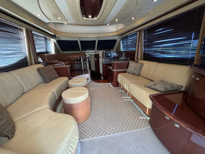 Slide: The Image of Luxurious interior of 2007 Sea Ray 52 Sedan Bridge yacht with plush seating and elegant design. - 20