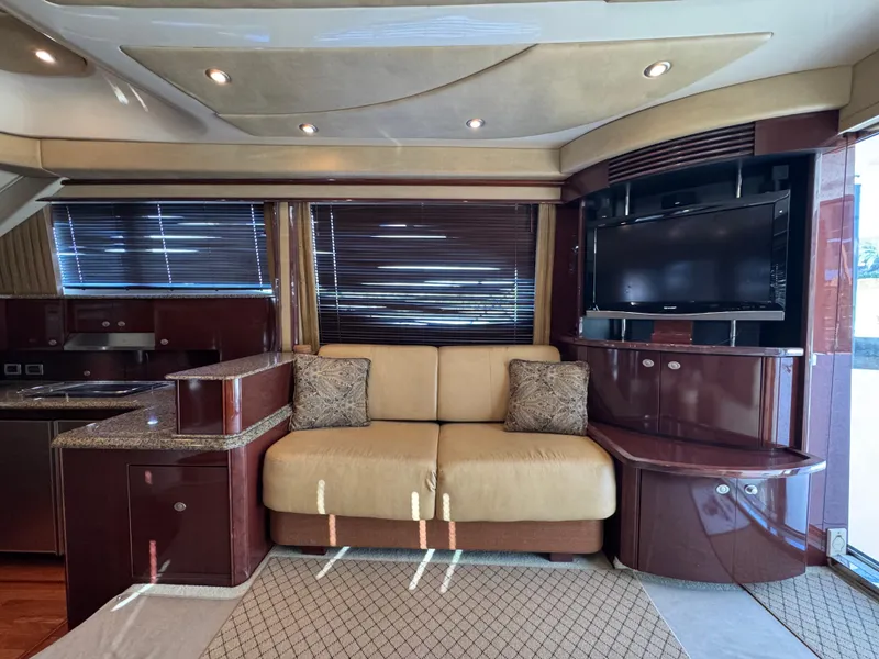 Slide: The Image of Luxurious interior of 2007 Sea Ray 52 Sedan Bridge yacht with sofa and TV. - 22