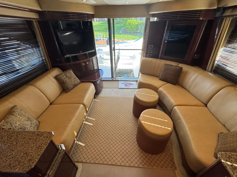 Slide: The Image of Luxurious interior of 2007 Sea Ray 52 Sedan Bridge yacht with plush seating and modern decor. - 23