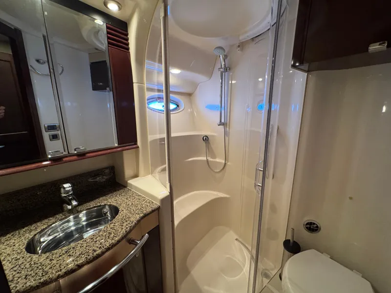 Slide: The Image of Luxurious bathroom in 2007 Sea Ray 52 Sedan Bridge yacht with shower and granite countertop. - 38