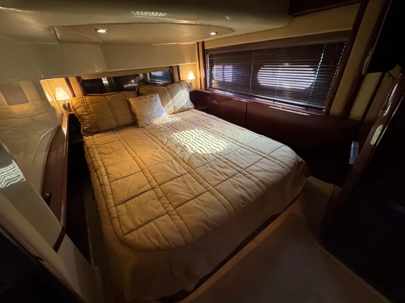 Slide: The Image of Luxurious bedroom interior of 2007 Sea Ray 52 Sedan Bridge yacht. - 39