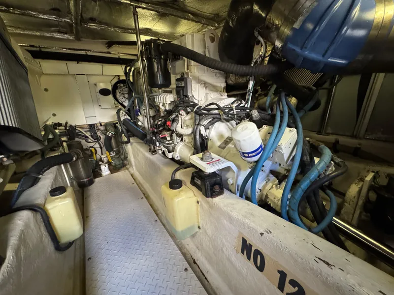 Slide: The Image of Engine room of a 2007 Sea Ray 52 Sedan Bridge with visible machinery and components. - 42