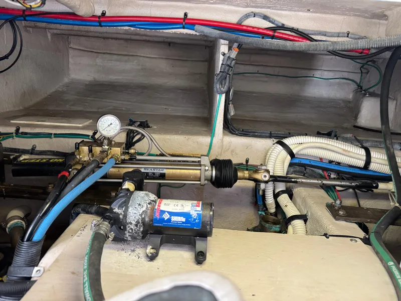 Slide: The Image of Engine compartment of a 2007 Sea Ray 52 Sedan Bridge, showing hydraulic and electrical systems. - 47