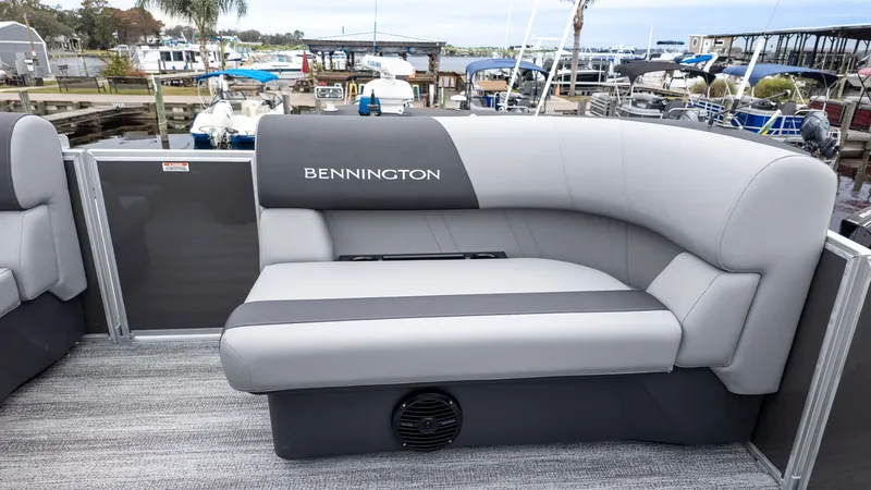 Slide: The Image of Bennington 16 S Cruise seat on a docked boat. - 11