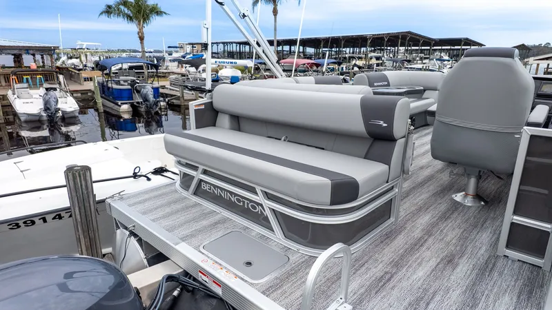 Slide: The Image of Bennington 16 S Cruise Jump Seat 2026 at dock, gray upholstery. - 6