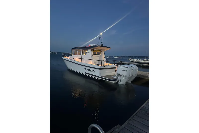 Slide: The Image of 2025 Sargo 28 boat docked at night. - 10